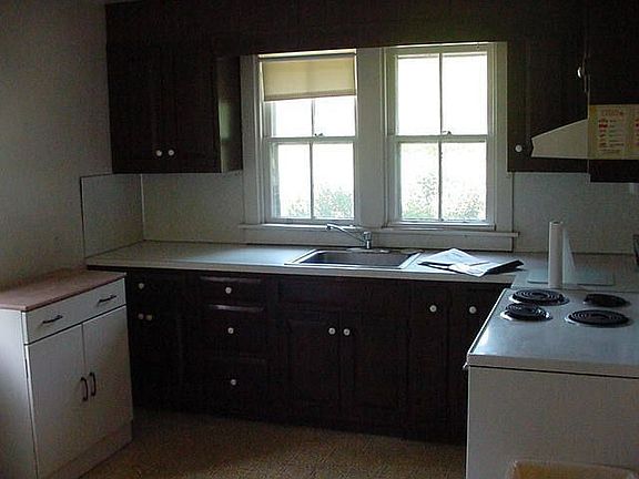 One side of Kitchen. The new stove is gas.