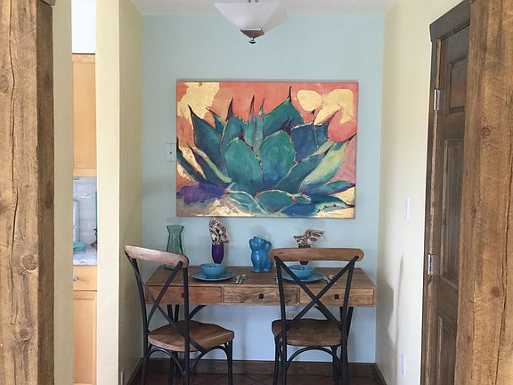 Saltillo floors in dining / work station. Sitting for 2, or computer station.