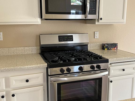 Brand new gas stove with built in microwave