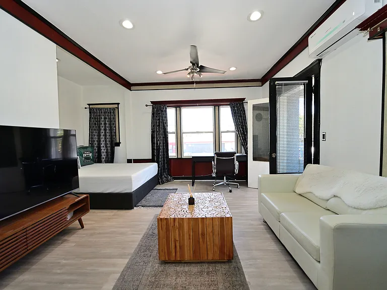 Fully Furnished & Updated LARGE and BRIGHT Studio w/ in-unit laundry + private balcony + parking