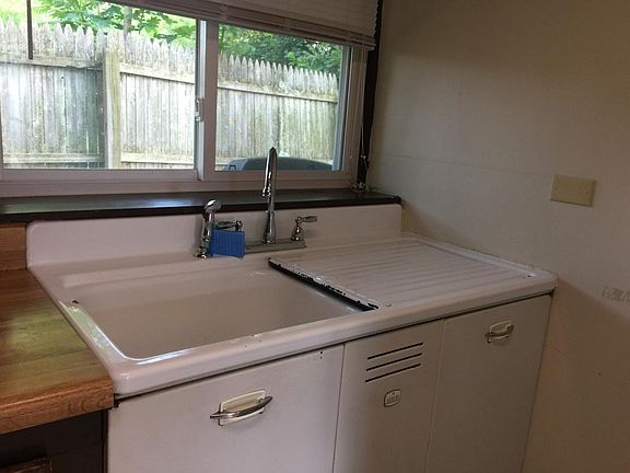 kitchen sink area, with plenty of space for plants by the wi