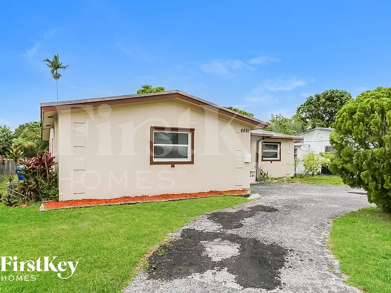 6891 NW 25th Ct — Photo 1