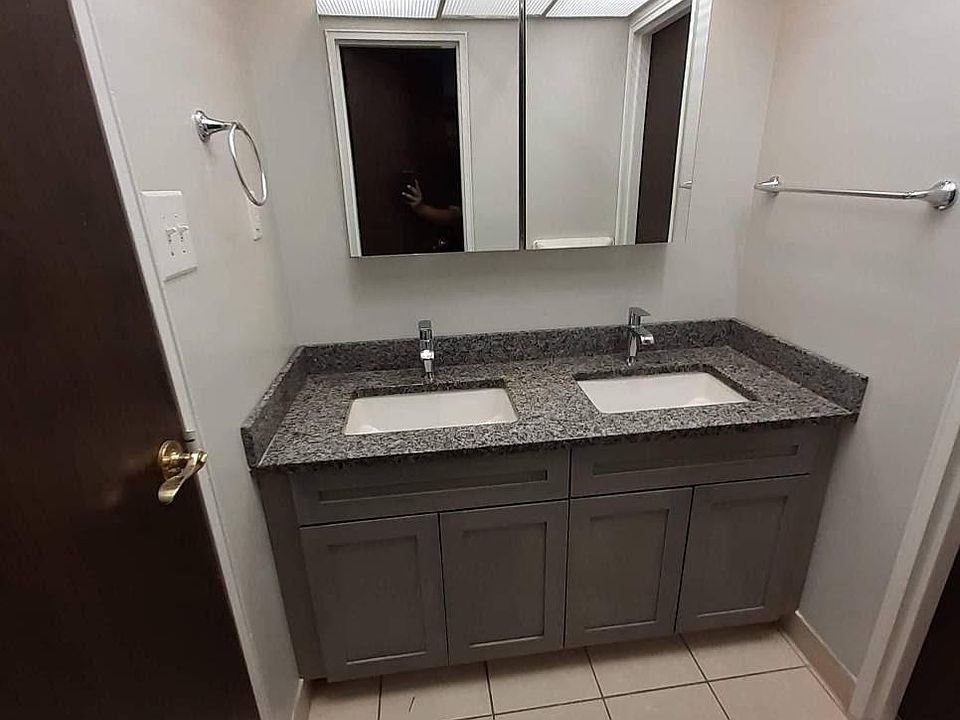 New bathroom vanity with double sink and oversized medicine cabinet