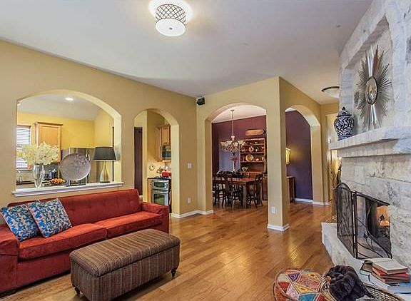 The open floor plan promotes an easy flow from the entry to the dining, living and kitchen areas.