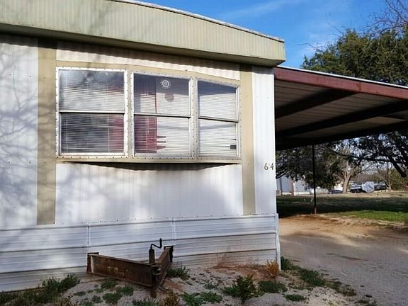 Large metal-covered carport, so there's room for your vehicles out of the weather