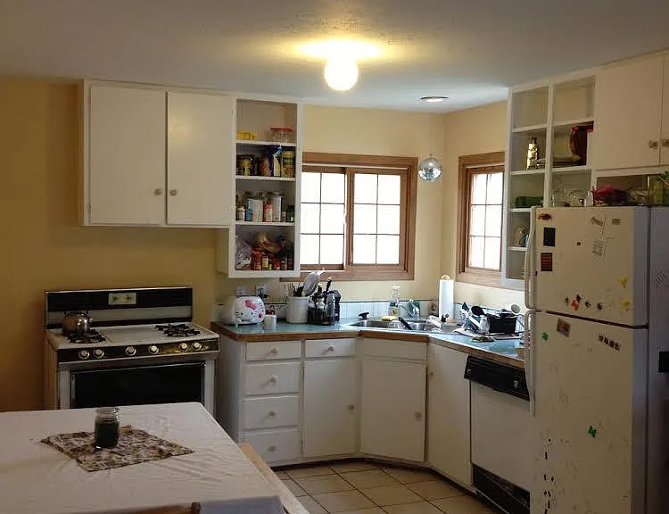Open floor plan with kitchen open to the bright, sunny living room.