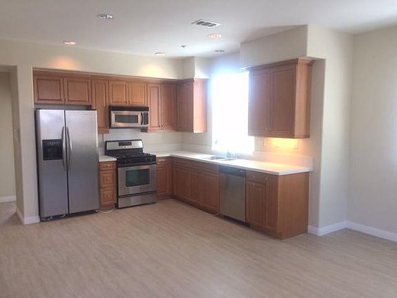 Appliances included solid surface countertop all laminate flooring throughout.