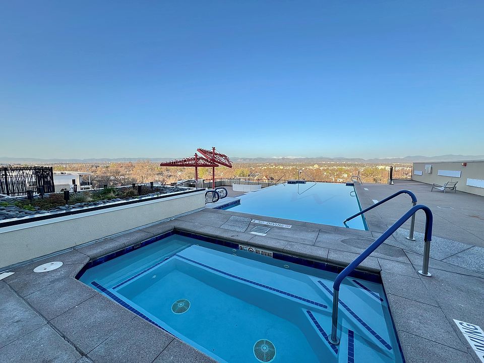 rooftop infinity pool, hot tub, and grill area