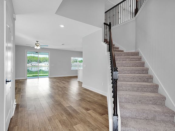 Be welcomed into the home with this beautiful entry way with access to upstairs and the family room