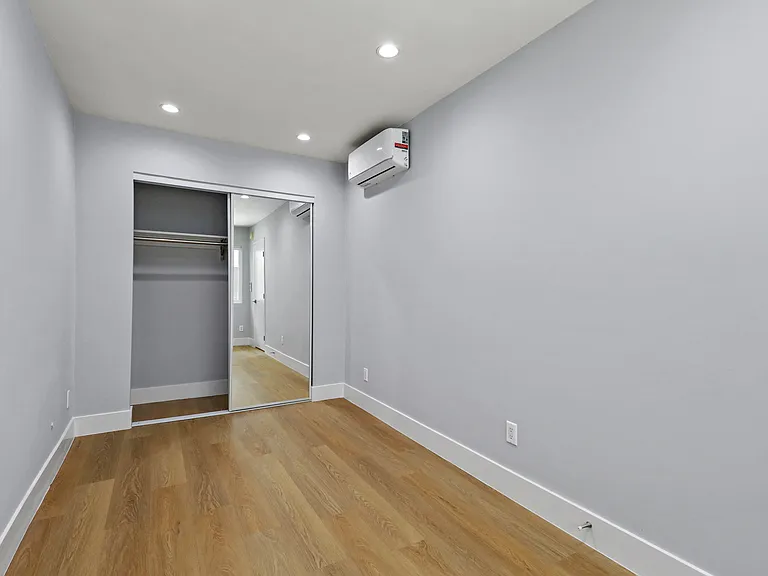 Bedroom with Mirrored Closet