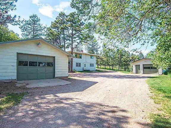 oversized 2 car garage and a single stall garage