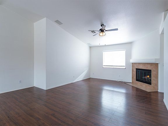 Living Room with New Ceiling Fan and Gas Fireplace