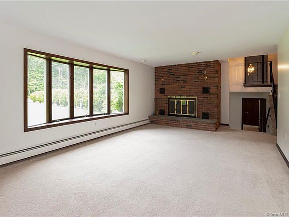 Great sized Living Room has a wood burning fireplace.