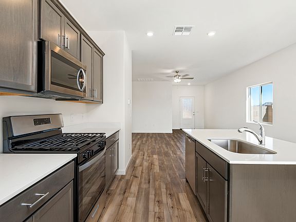 The kitchen overlooks the spacious living area.