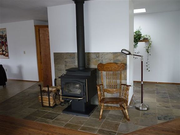 Wood stove sits on new tile flooring