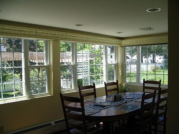 windowed eating area overlooks backyard..