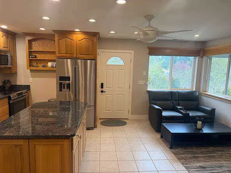 Kitchen and living room area looking to the main entrance