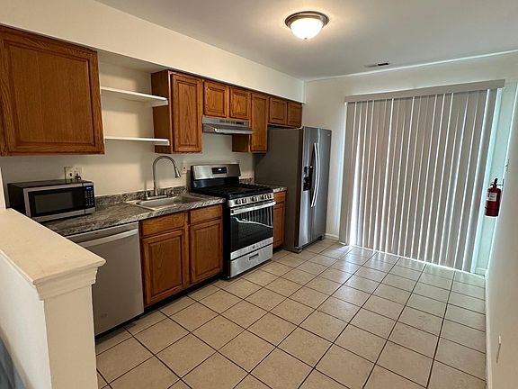 Kitchen with back door to the backyard.
