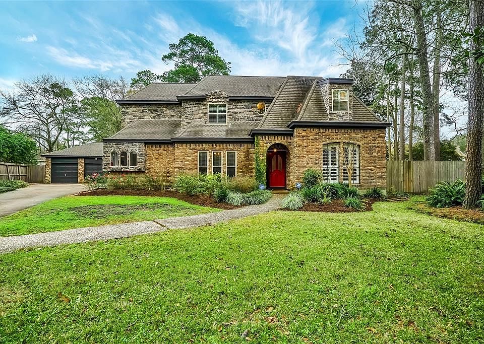 Welcome to the Distinctive 7507 Pine Wind Court with recent exterior paint, stone elevation to add a touch of elegance, 3 car garage, lush landscape