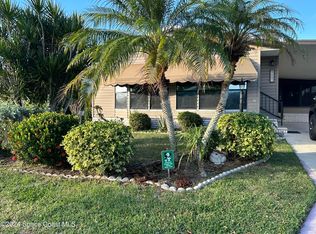 602 Dolphin Cir, Barefoot Bay, FL 32976