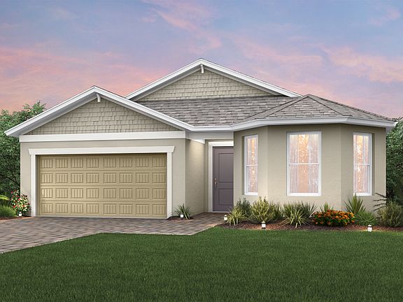 The Marina, a single-story home with a 2 car garage, shown as Home Exterior C2B