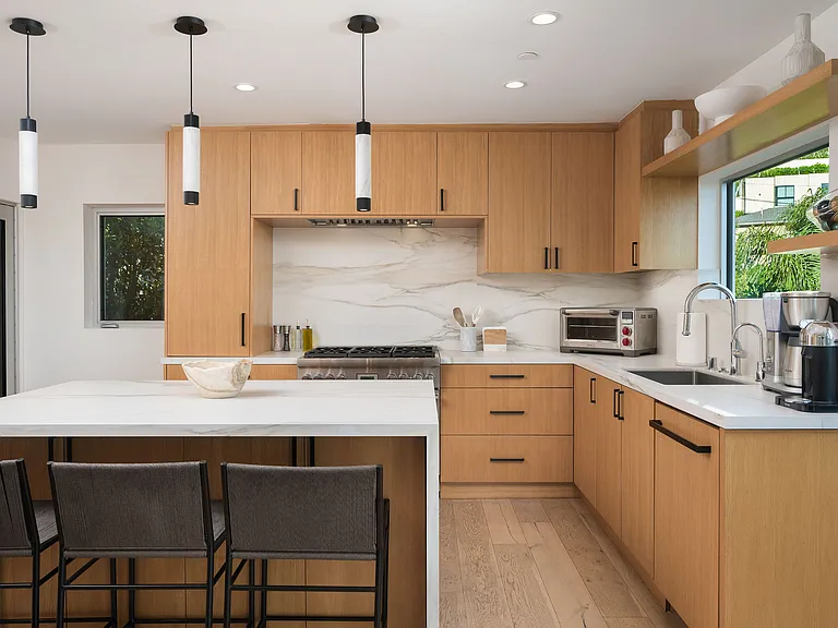 The large chefs kitchen with stainless steel appliances, tons of counter space and stunning views!