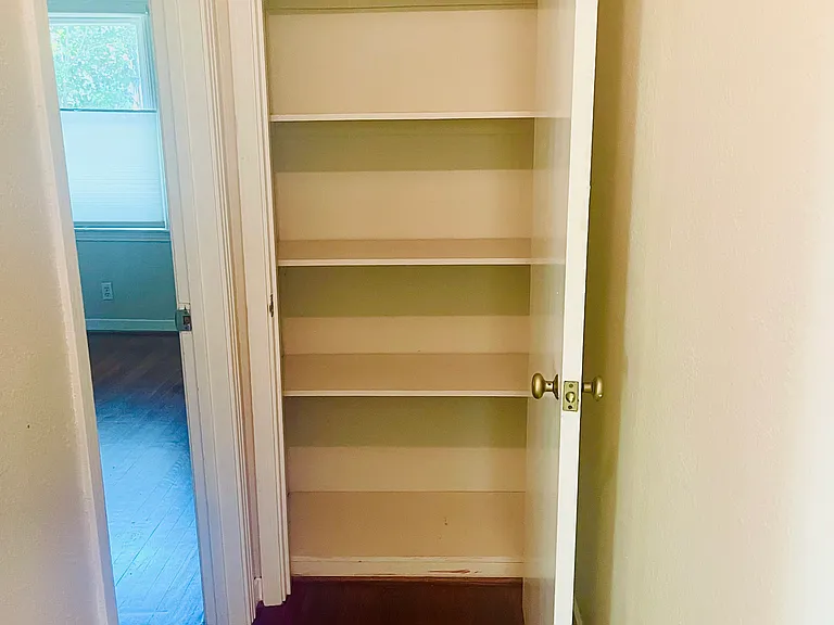 Ample linen closet in hallway