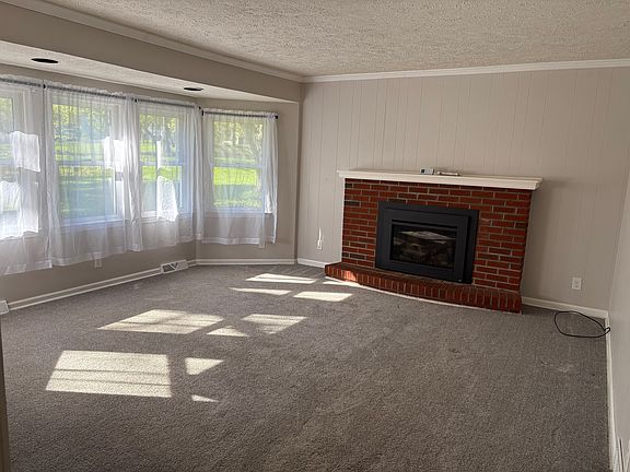 Main floor living room with gas fireplace.