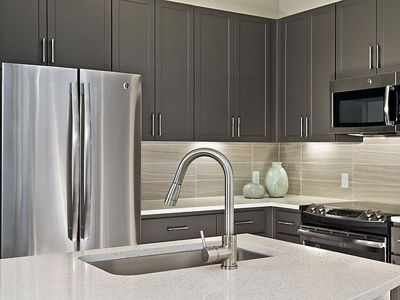 Premium quartz countertops and subway tile backsplash