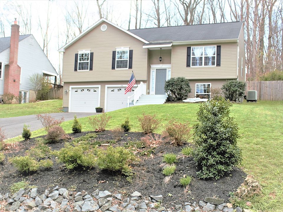 Front of the house from the street. Professional landscaping with items for all seasons. Rock beds along the driveway and rock beds along the street runoff.