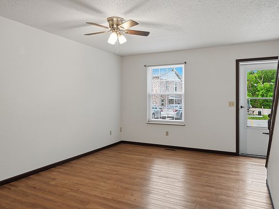 Big living room with luxury vinyl plank flooring the main floor. Newer windows and lots of ceiling fans.