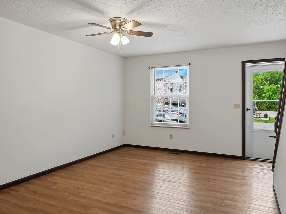 Big living room with luxury vinyl plank flooring the main floor. Newer windows and lots of ceiling fans.