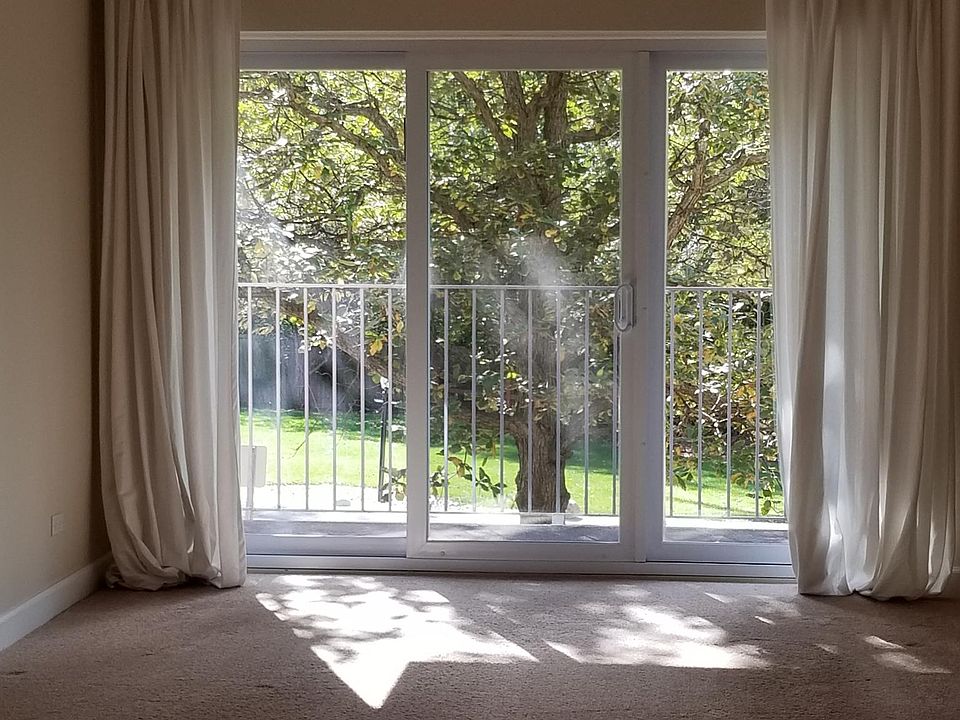 South facing balcony overlooking park like grounds.