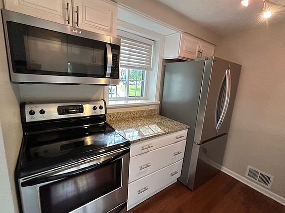 Kitchen with newer Stainless Steel appliances and Granite counters