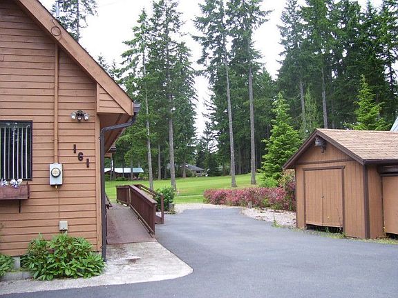Looking from paved driveway toward 5th fairway