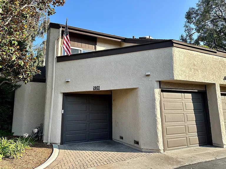 Two car attached garage with balcony above
