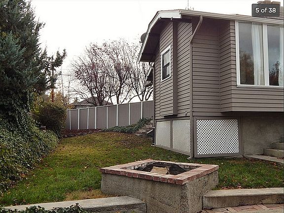 Fenced side yard w/ firepit
