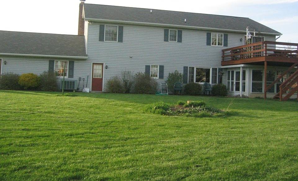 Rear of house - rental entrance through Sun Porch under deck