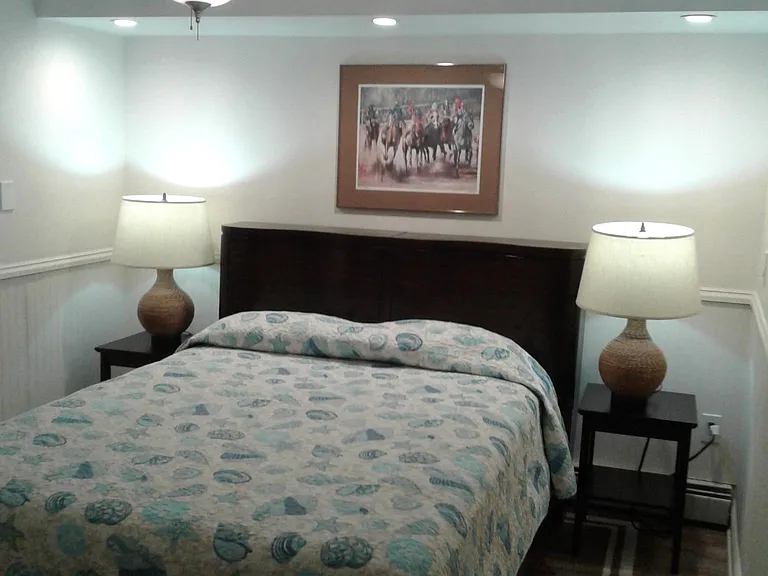 Third guest bedroom with queen size bed and large closet.