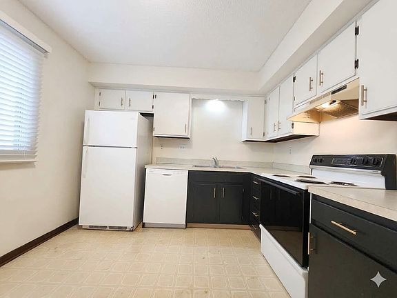 Kitchen under remodel. New flooring with white baseboards to be complete 6-30-2026