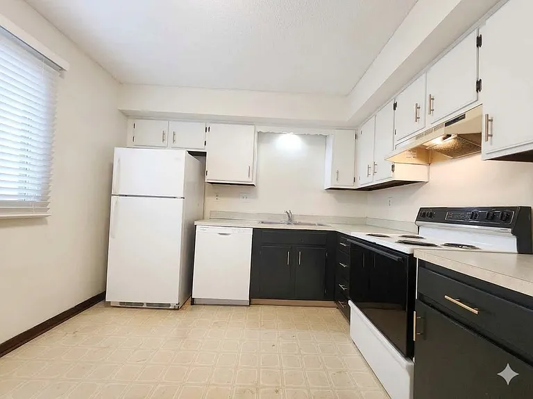 Kitchen under remodel. New flooring with white baseboards to be complete 6-30-2026