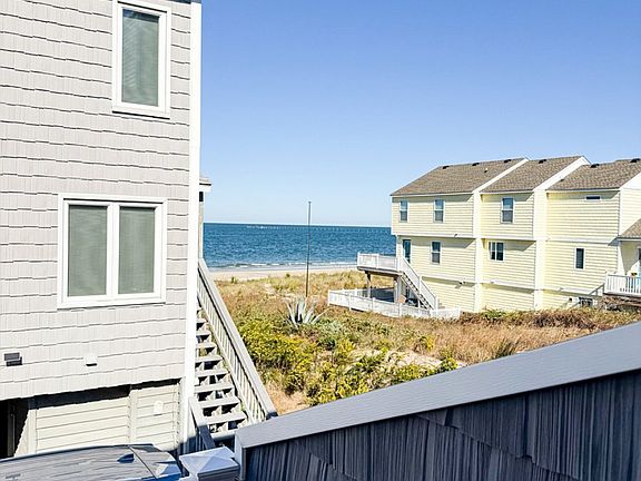 Beach/water views everyday. Enjoy from the main floor balcony and open living room
