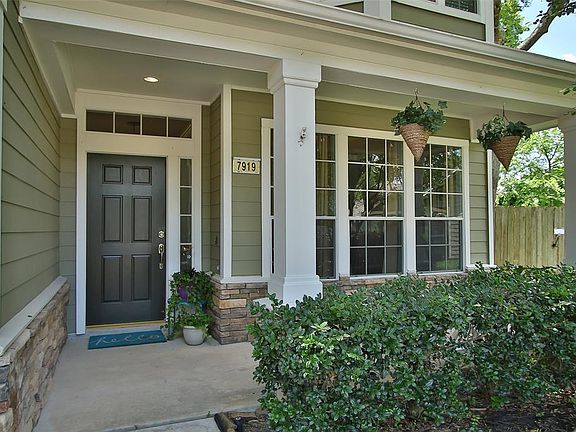 This Home Offers Impressive Curb Appeal and a Covered Front Porch Shaded by Mature Trees.