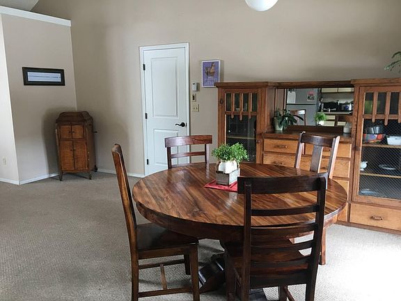 Spacious dining room with French doors to back patio.