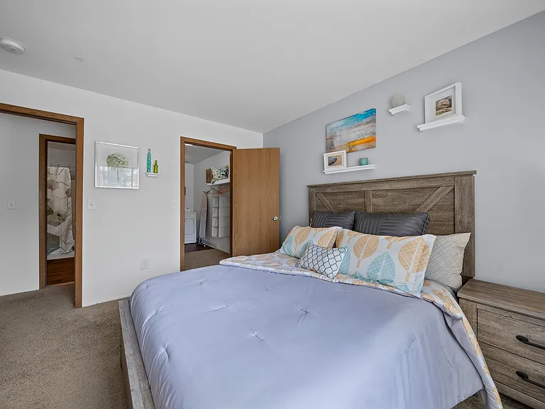 Spacious bedroom with ample storage space at Woodland Villa Apartments in Westland, MI.
