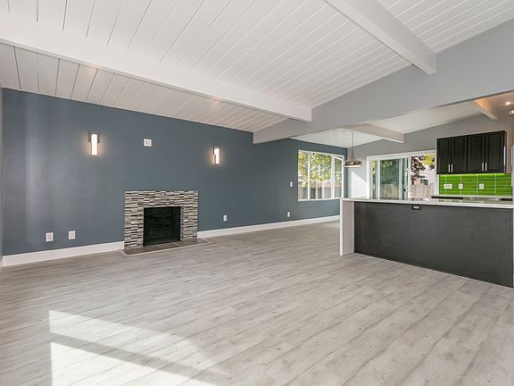 Wood burning fireplace and large windows