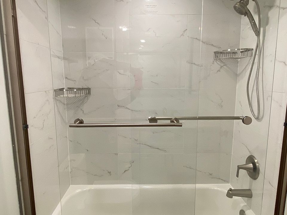 New tub, glass enclosure, shower fixtures.