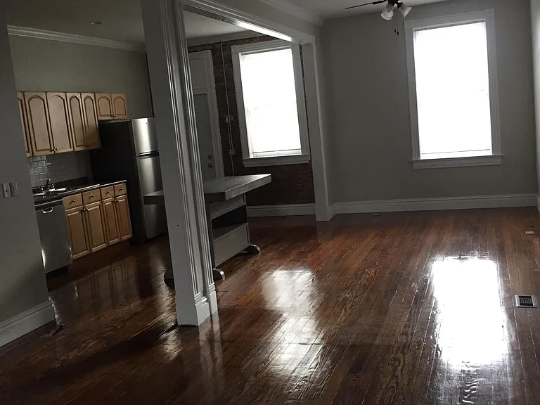 View of large open living and kitchen area with kitchen island