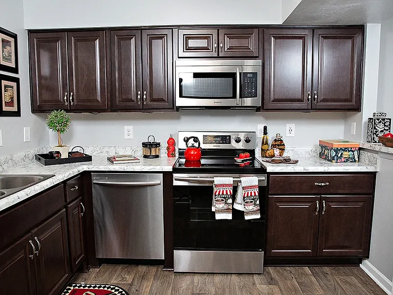 Spacious kitchen with stainless steel appliances at Haw Creek Mews