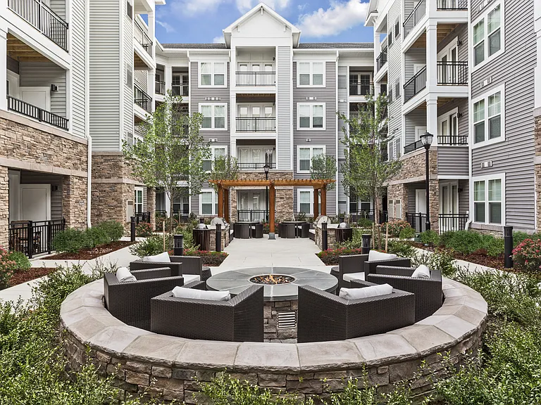 Beautifully Landscaped Courtyard with Firepits, Wet Bar, Seating Areas, Entertaining Space, and an Outdoor TV